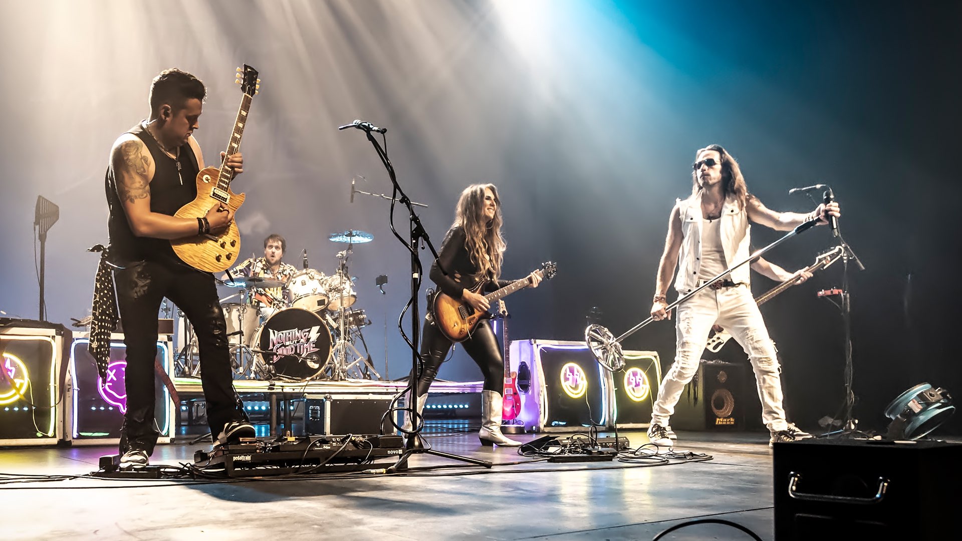 Nothing But A Good Time on stage, guitars under the spotlights